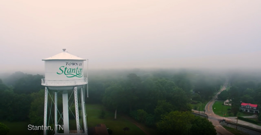 Water tower for the Town of Stanton, Tennessee with trees in the background