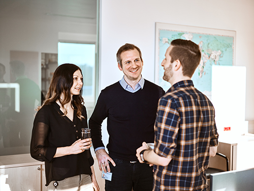 Group of people talking in an office