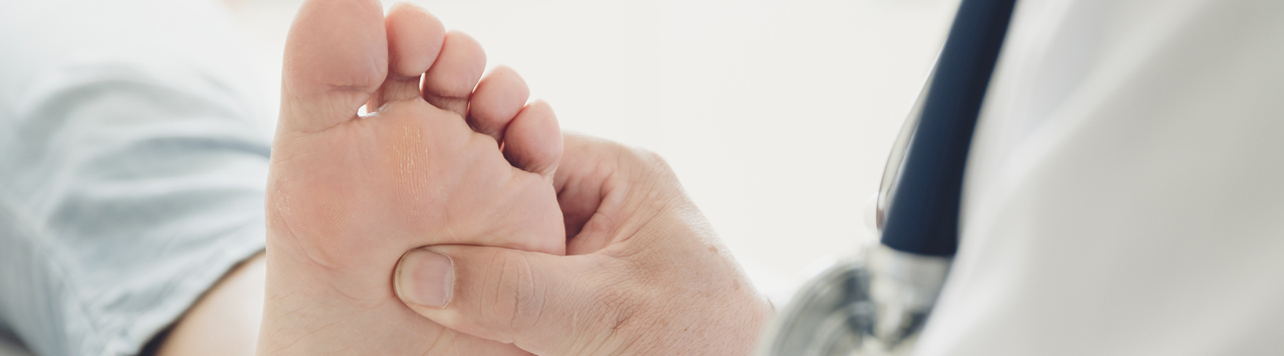 Doctor examining a person's foot