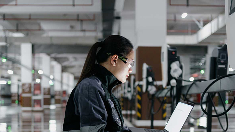 Person looking at a laptop screen in a testing laboratory