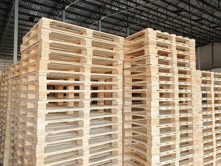 Stacks of recyclable wooden shipping pallets