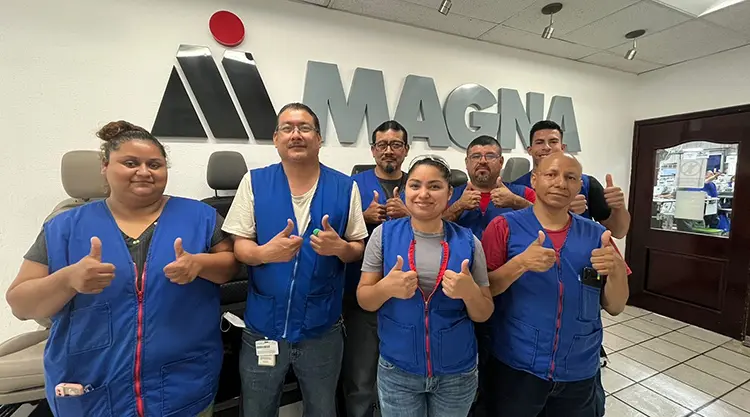 Team from Magna's division in Sabinas, Mexico signing "thumbs up"