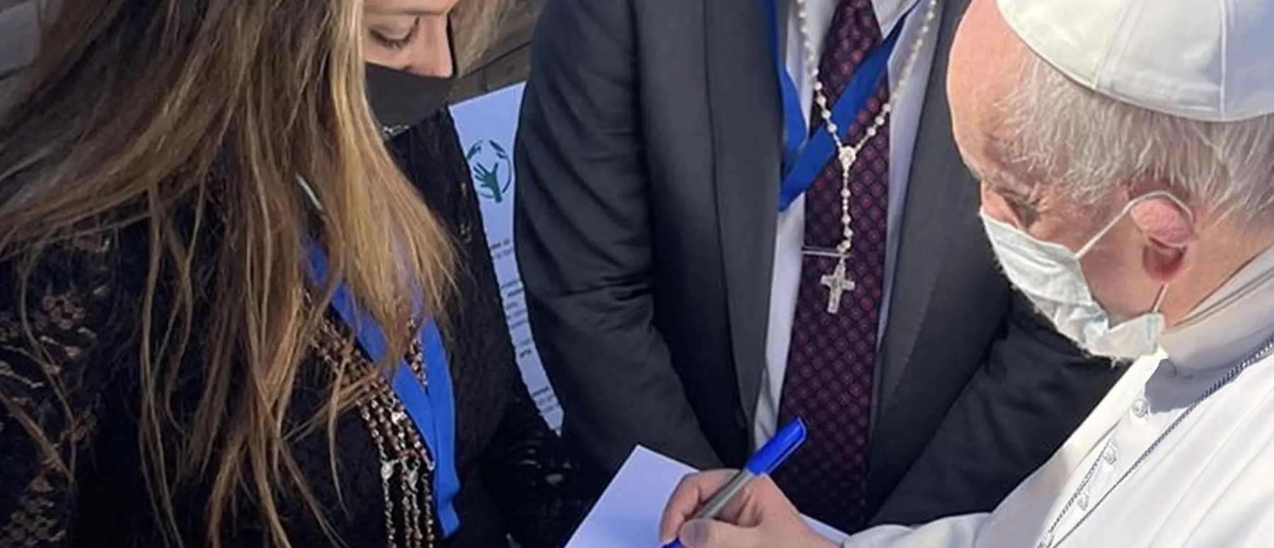 Pope Francis signing the sketch of the Popemobile